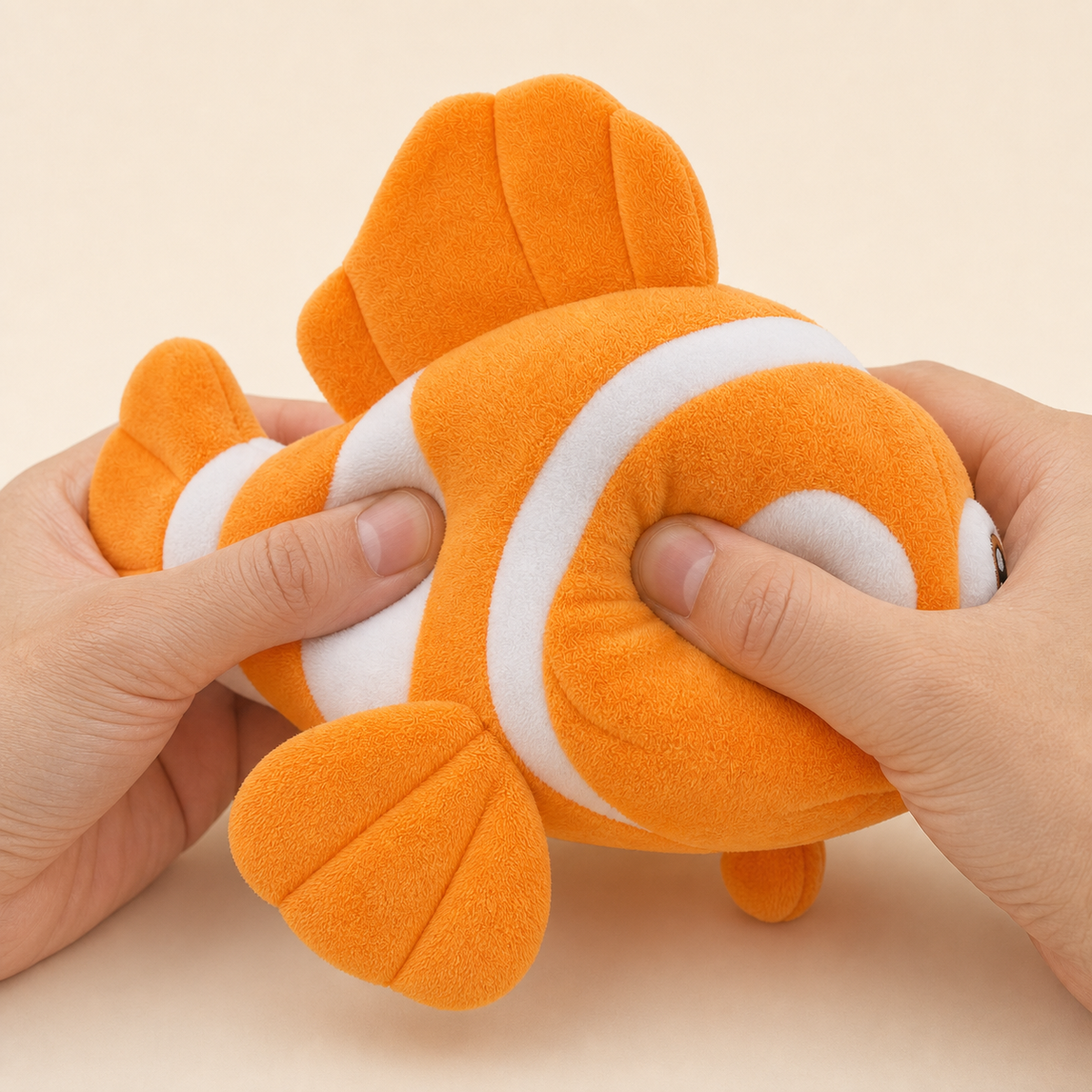 Soft polyester texture of orange clownfish plush toy