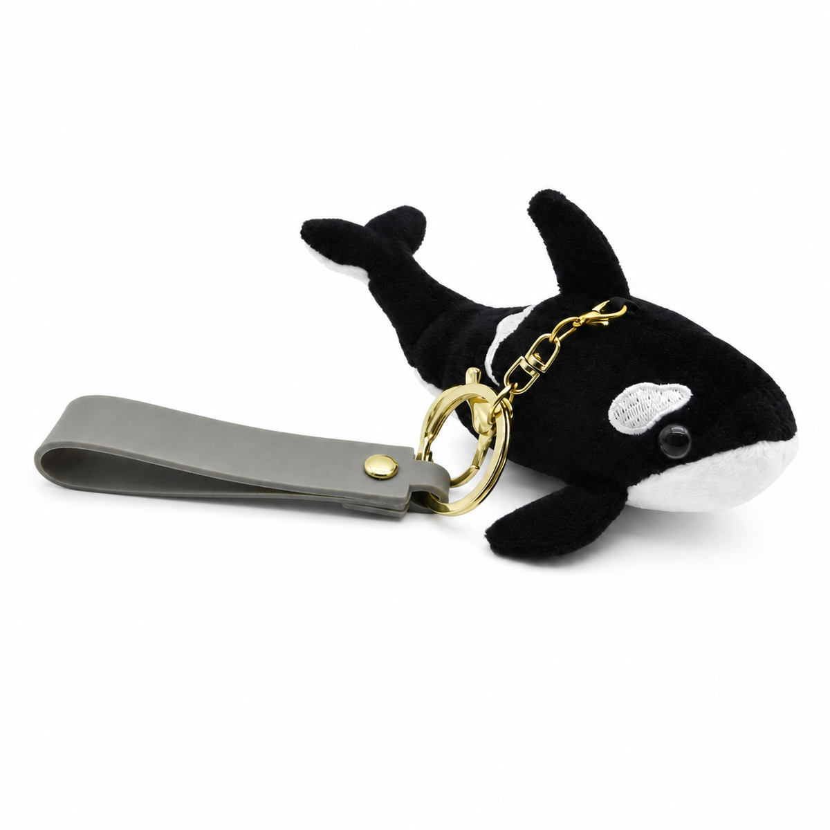 Mini orca whale bag charm in a lifestyle setting