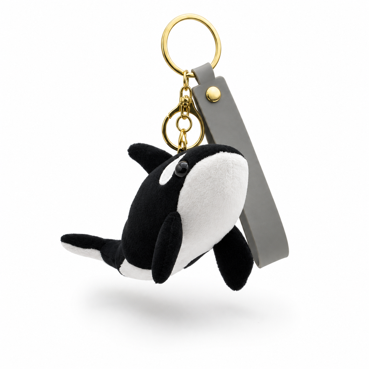 Mini orca plush keychain front view on a white background