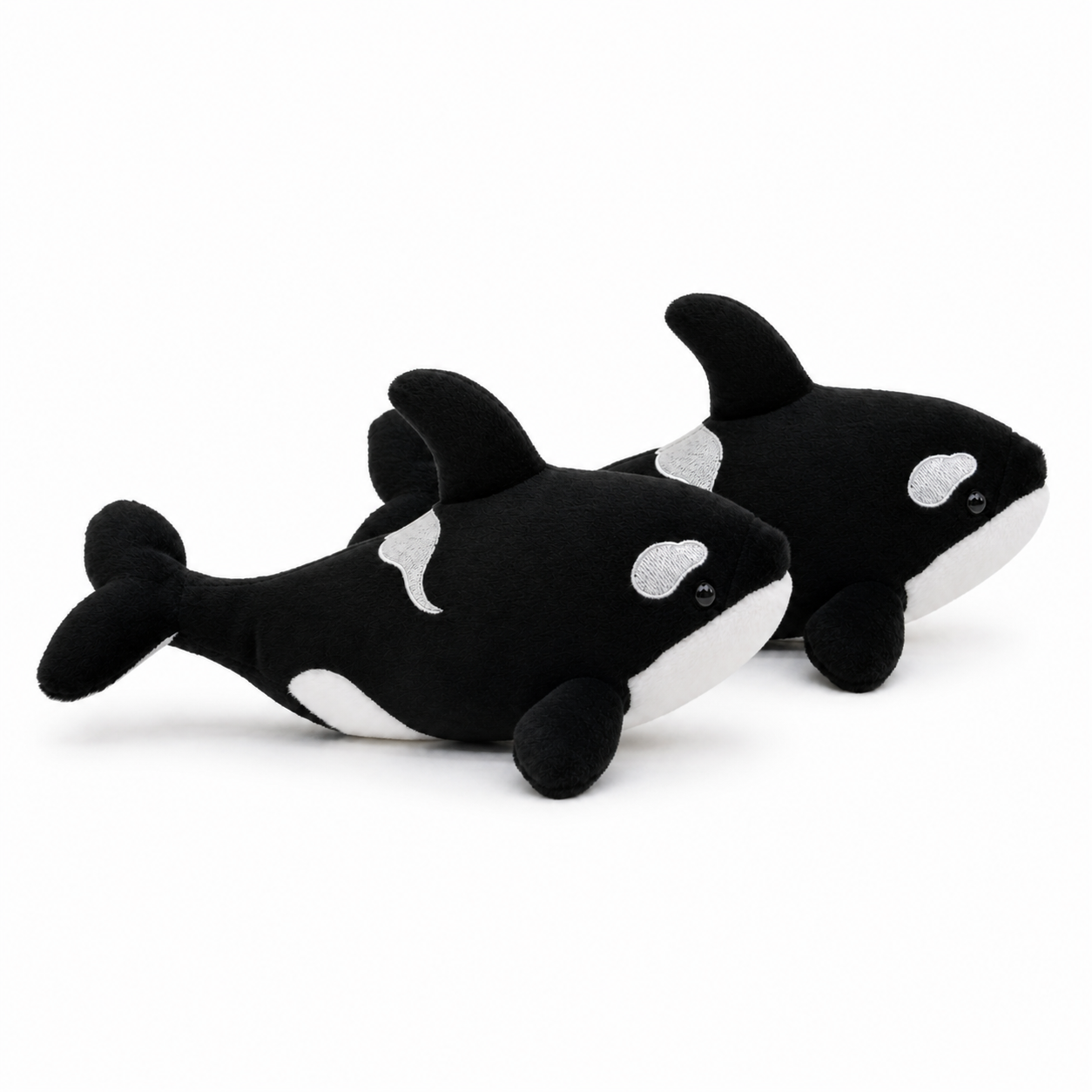Side view of two Hzboo realistic orca plush dolls in the two-pack