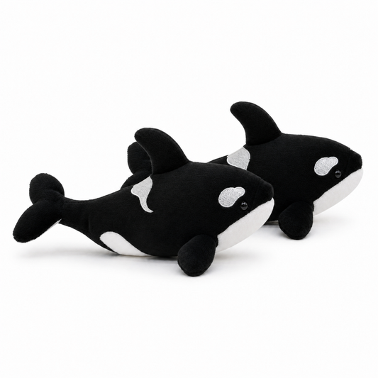 Side view of two Hzboo realistic orca plush dolls in the two-pack